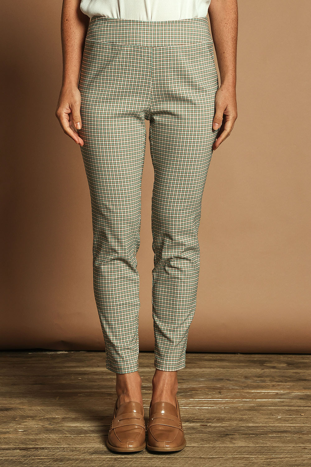 Model Katie wearing size 10 of the Pull On Check Pants in colour Mintcheck (Blue), from the front, cropped image