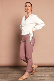 Model Katie wearing size 10 of the Pull On Check Pants in colour Redcheck (Red), from the front, showing the whole outfit