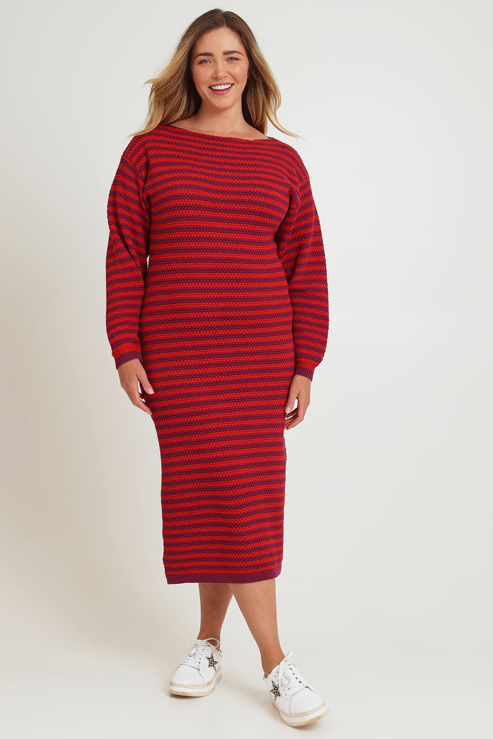Model Chanel wearing size XL of the Cotton Stripe Knit Dress in colour Redpurple (Red), from the front, showing the whole outfit