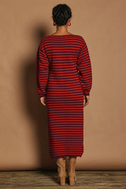 Model Katie wearing size S of the Cotton Stripe Knit Dress in colour Redpurple (Red), from the back