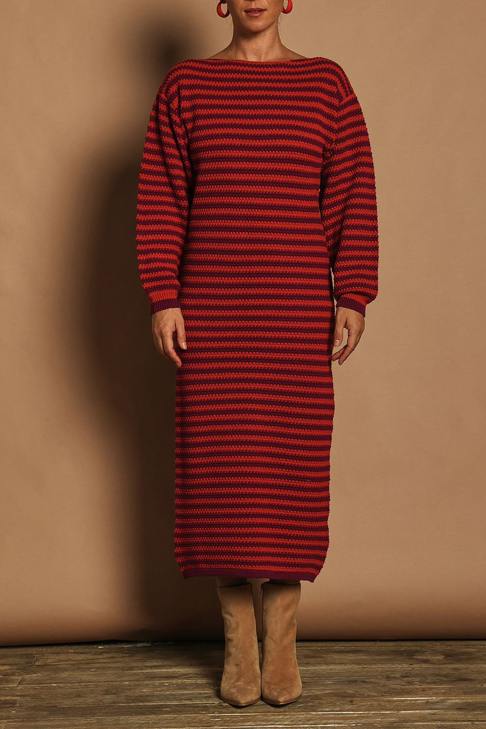 Model Katie wearing size S of the Cotton Stripe Knit Dress in colour Redpurple (Red), from the front, cropped image