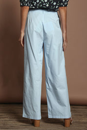 Model Madeline wearing size 10 of the Straight Leg Pant in colour Coolblue (Blue), from the back