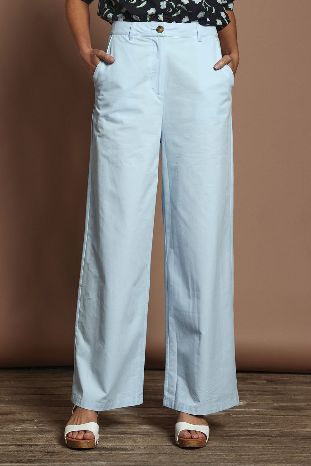 Model Madeline wearing size 10 of the Straight Leg Pant in colour Coolblue (Blue), from the front, cropped image