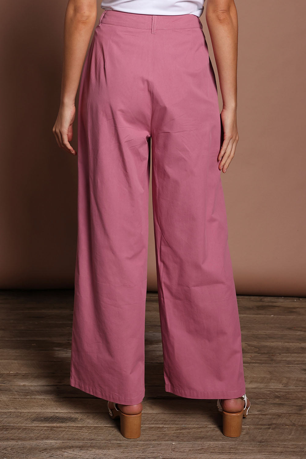 Model Madeline wearing size 10 of the Straight Leg Pant in colour Dustypink (Pink), from the back