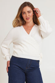 Model Chanel wearing size XL of the Wrap Knit Sweater in colour Cream (White), from the front, cropped image