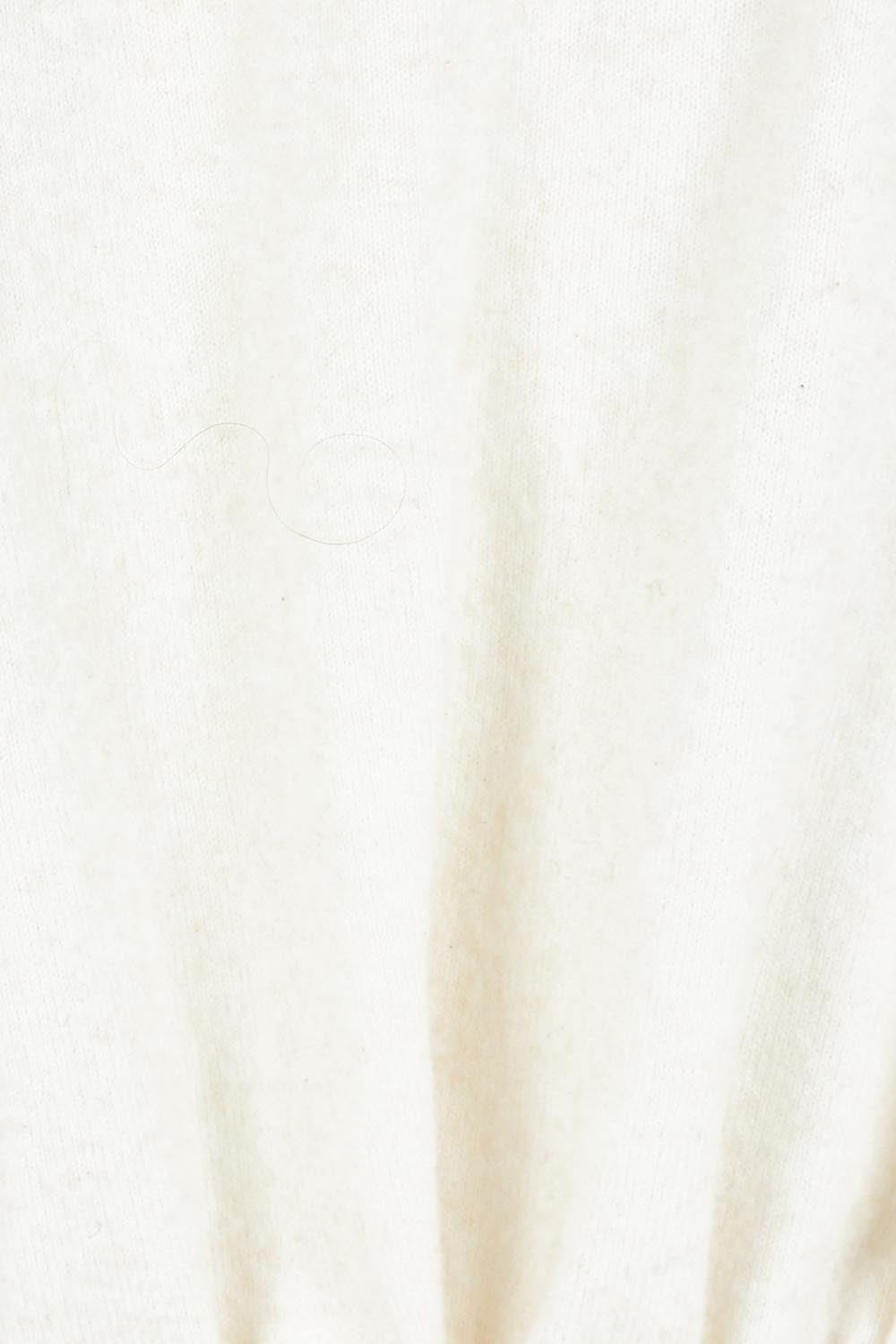 Product shot of the Wrap Knit Sweater in colour Cream (White), detail