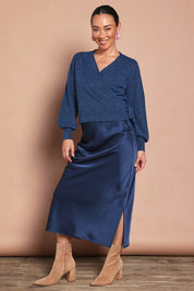 Model Katie wearing size S of the Wrap Knit Sweater in colour Dustyblue (Blue), from the front, showing the whole outfit