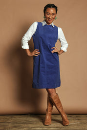 Model Katie wearing size 10 of the Corduroy Shift Dress in colour Bonnie (Blue), from the front, showing the whole outfit