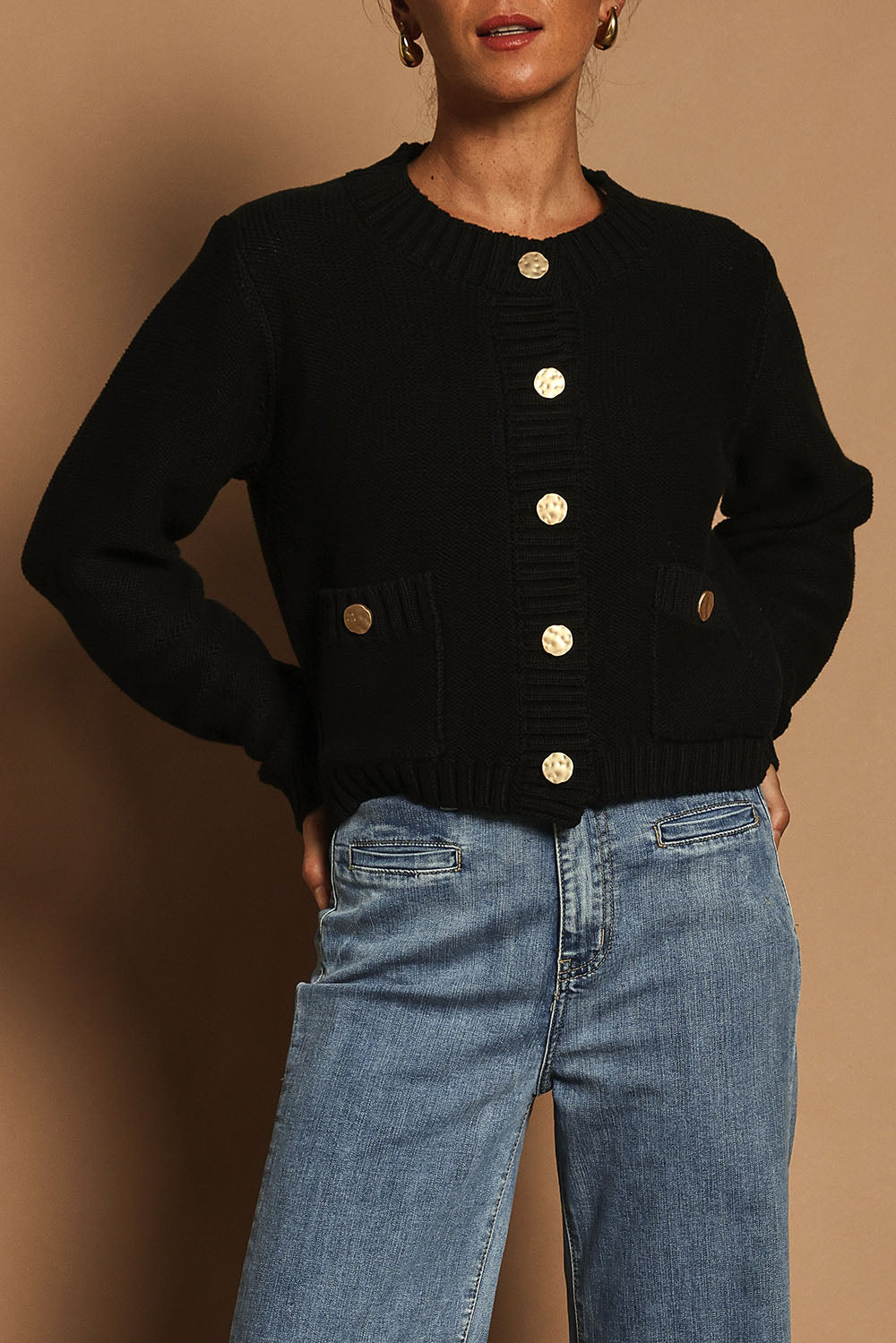 Model Katie wearing size S of the Cotton Cardigan in colour Black (Black), from the front, cropped image