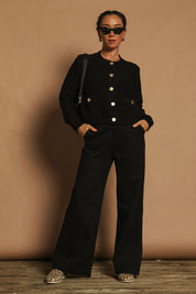 Model Katie wearing size S of the Cotton Cardigan in colour Black (Black), from the front, showing the whole outfit
