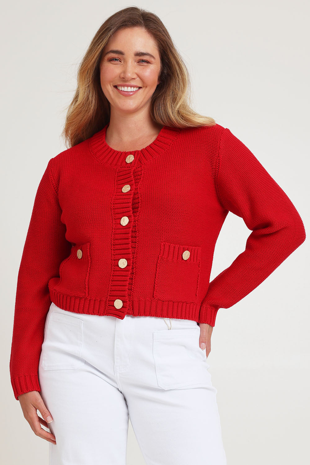 Model Chanel wearing size XL of the Cotton Cardigan in colour Red (Red), from the front, cropped image