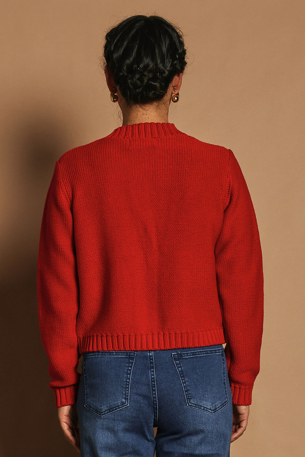 Model Katie wearing size S of the Cotton Cardigan in colour Red (Red), from the back