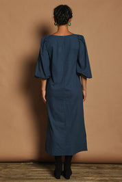 Model Katie wearing size 10 of the Puff Sleeve Midi Cotton Dress in colour Moroccan (Blue), from the back