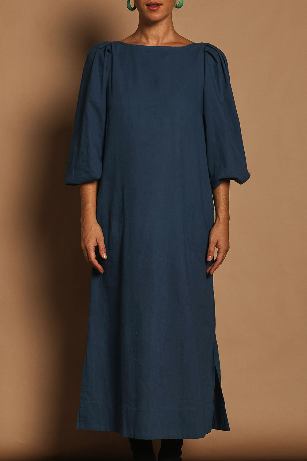 Model Katie wearing size 10 of the Puff Sleeve Midi Cotton Dress in colour Moroccan (Blue), from the front, cropped image