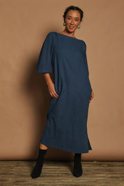 Model Katie wearing size 10 of the Puff Sleeve Midi Cotton Dress in colour Moroccan (Blue), from the front, showing the whole outfit