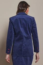 Model Madeline wearing size 10 of the Corduroy Blazer in colour Dustyblue (Blue), from the back