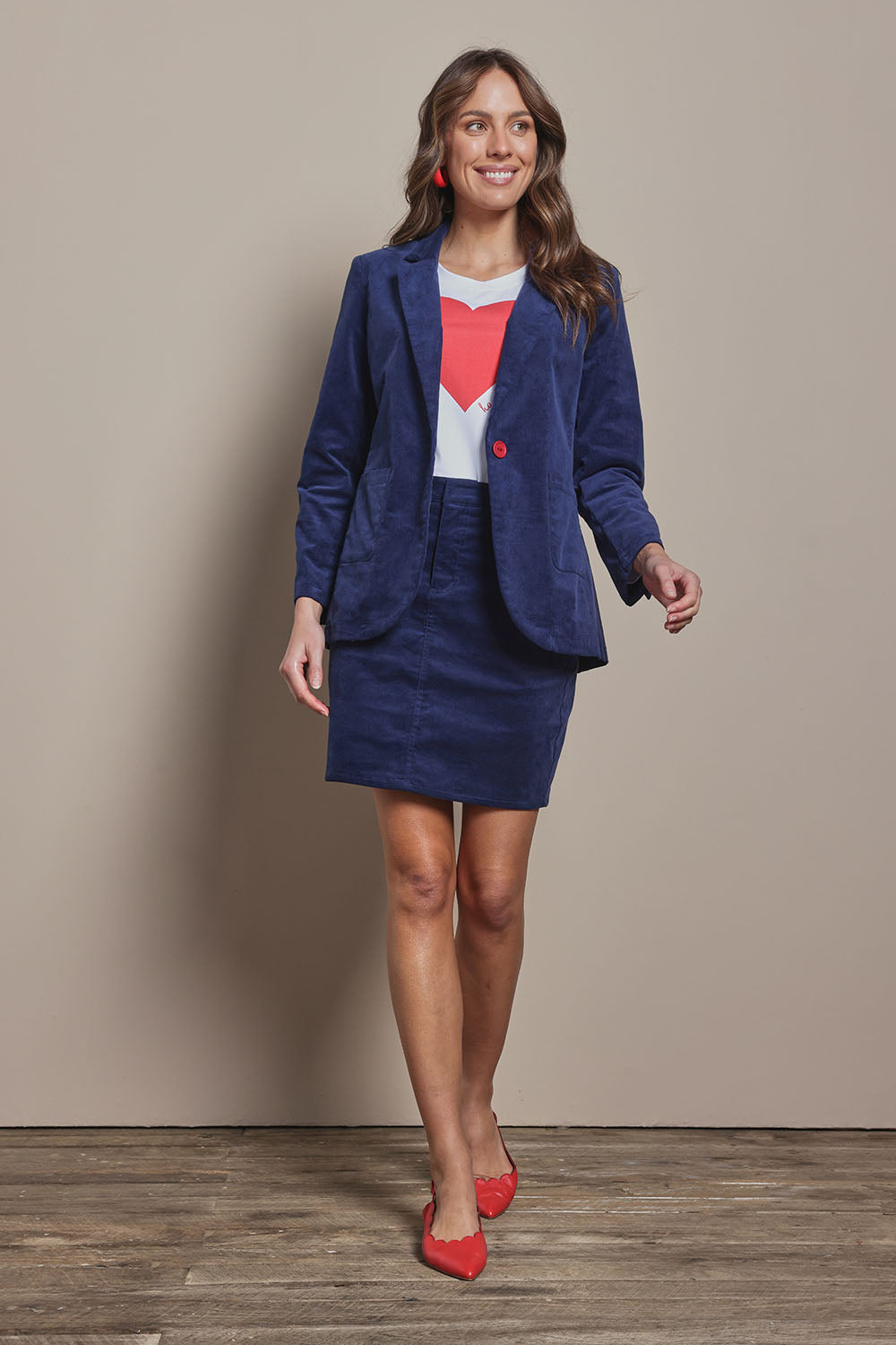 Model Madeline wearing size 10 of the Corduroy Blazer in colour Dustyblue (Blue), from the front, showing the whole outfit