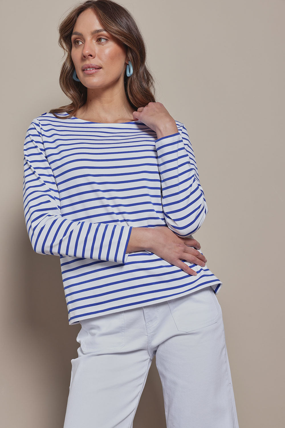 Model Madeline wearing size 10 of the Cotton Stripe Long Sleeve Top in colour Whiteblue (Blue), from the front, cropped image