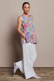 Model Katie wearing size 10 of the Printed Side Split Tunic in colour Petalpop, from the front, showing the whole outfit