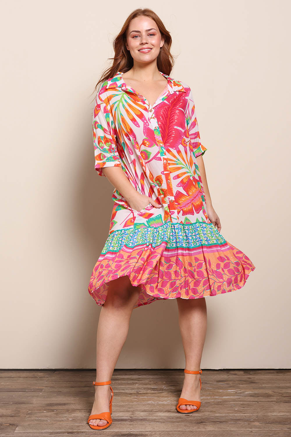Model Georgiel wearing size 10 of the Button Up Dress – Fern in colour Fern, from the front