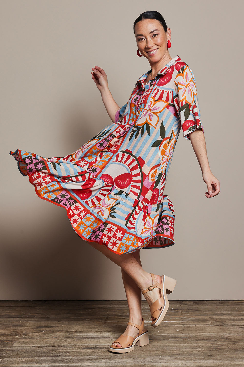 Model Katie wearing size 10 of the Button Up Dress in colour Picnic, from the front, showing the whole outfit