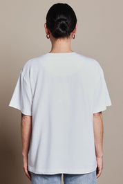 Model Katie wearing size 10 of the Printed Cotton Blend Tee in colour Lobster, from the back