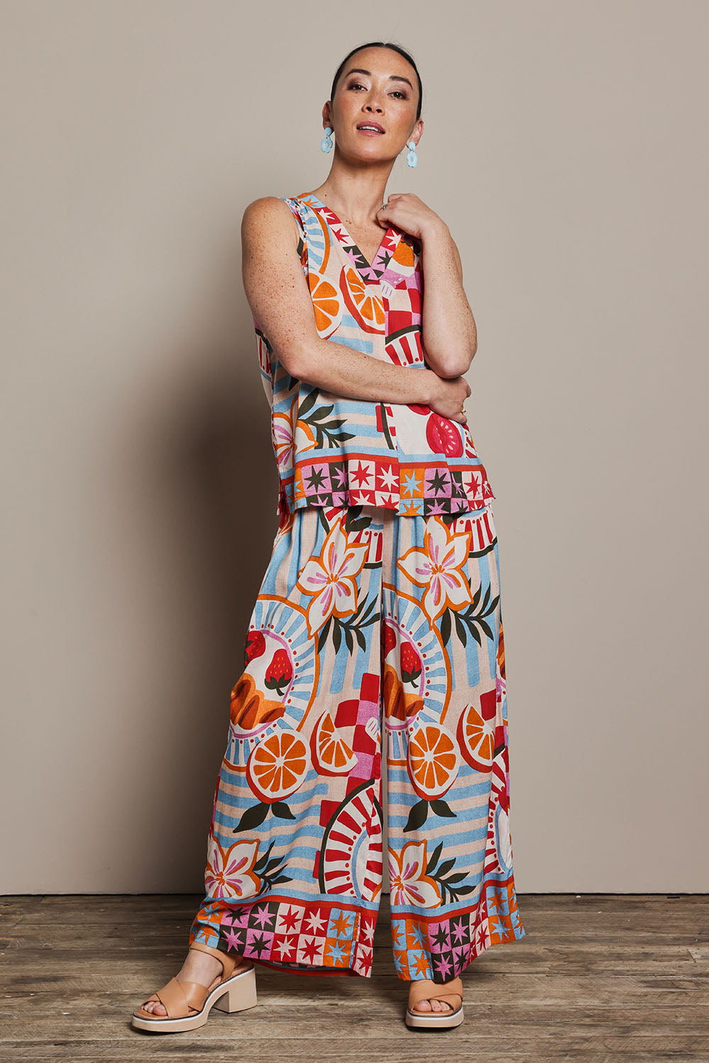Model Katie wearing size 10 of the V Neck Tank in colour Picnic, from the front, showing the whole outfit