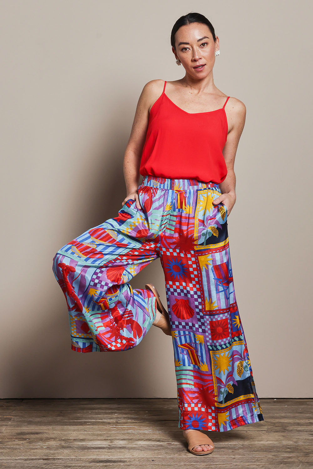 Model Katie wearing size 10 of the Straight Leg Pull On Pants in colour Lobster, from the front, showing the whole outfit