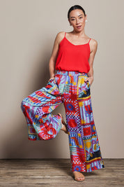 Model Katie wearing size 10 of the Straight Leg Pull On Pants in colour Lobster, from the front, showing the whole outfit