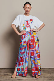 Model Katie wearing size 10 of the Straight Leg Pull On Pants in colour Lobster, from the front, showing the whole outfit