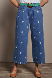 Model Madeline wearing size 10 of the Daisy Cotton Crop Jean in colour Daisy (Blue), from the front, cropped image