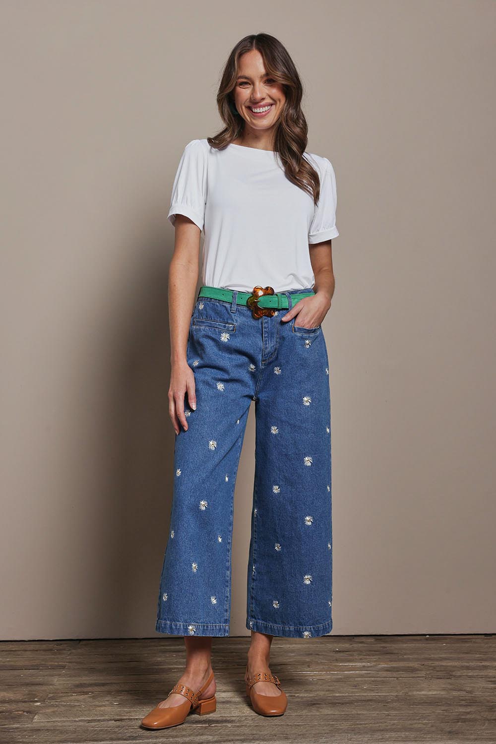 Model Madeline wearing size 10 of the Daisy Cotton Crop Jean in colour Daisy (Blue), from the front, showing the whole outfit
