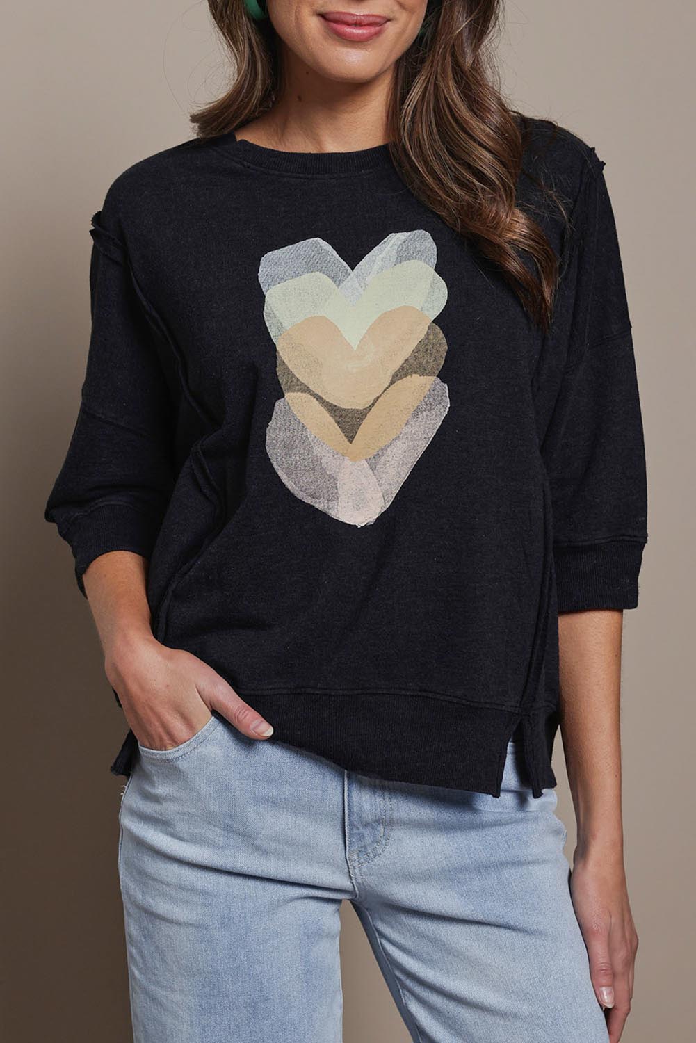 Model Madeline wearing size 10 of the Heart 3/4 Sleeve Cotton Jumper in colour Blackbeige (Black), from the front, cropped image