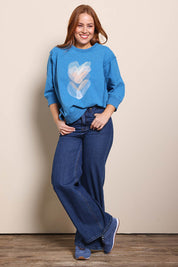 Model Georgiel wearing size 10 of the Heart 3/4 Sleeve Jumper – Bluebeige in colour Bluebeige, from the front