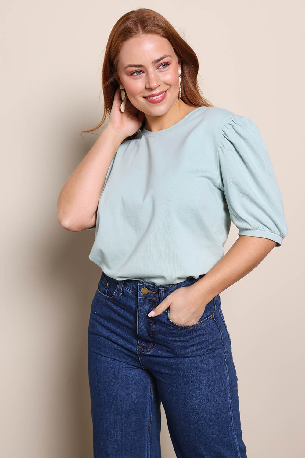 Model Georgiel wearing size 10 of the Cotton Jersey Puff Sleeve Top – Lightsage in colour Lightsage, in a cropped view