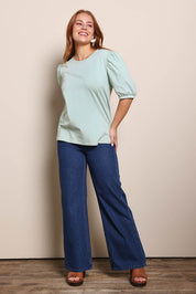 Model Georgiel wearing size 10 of the Cotton Jersey Puff Sleeve Top – Lightsage in colour Lightsage, from the front