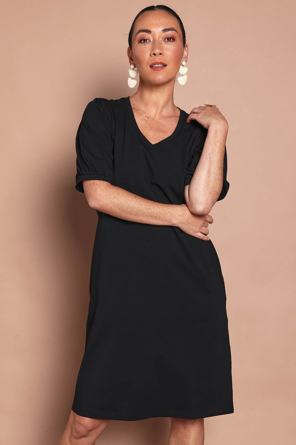 Model Katie wearing size 10 of the Cotton Jersey Puff Sleeve Dress in colour Black (Black), from the front, cropped image