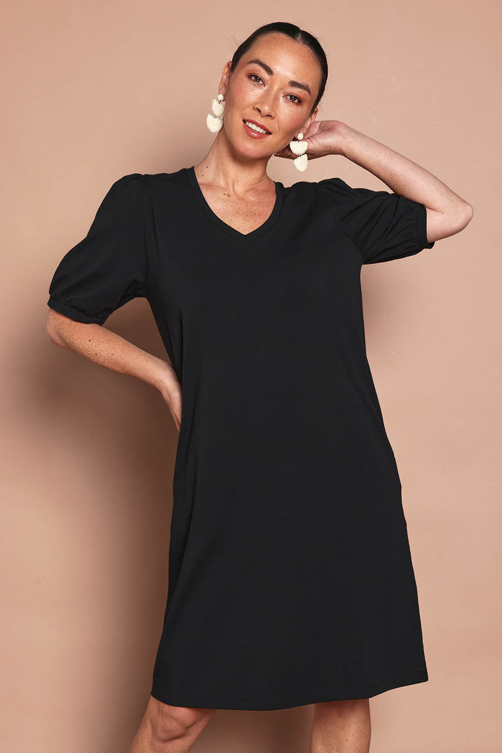Model Katie wearing size 10 of the Cotton Jersey Puff Sleeve Dress in colour Black (Black), from the front, cropped image