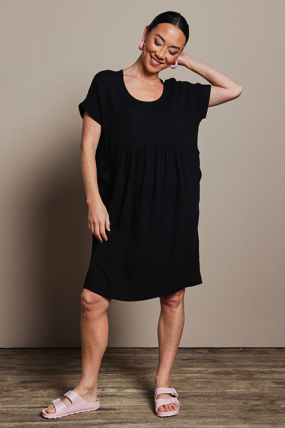 Model Katie wearing size 10 of the Viscose Linen Short Sleeve Dress in colour Black (Black), from the front, showing the whole outfit