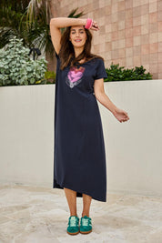 Model Tegand wearing size 10 of the Heart Logo Dress – Inkpink in colour Inkpink, from the front