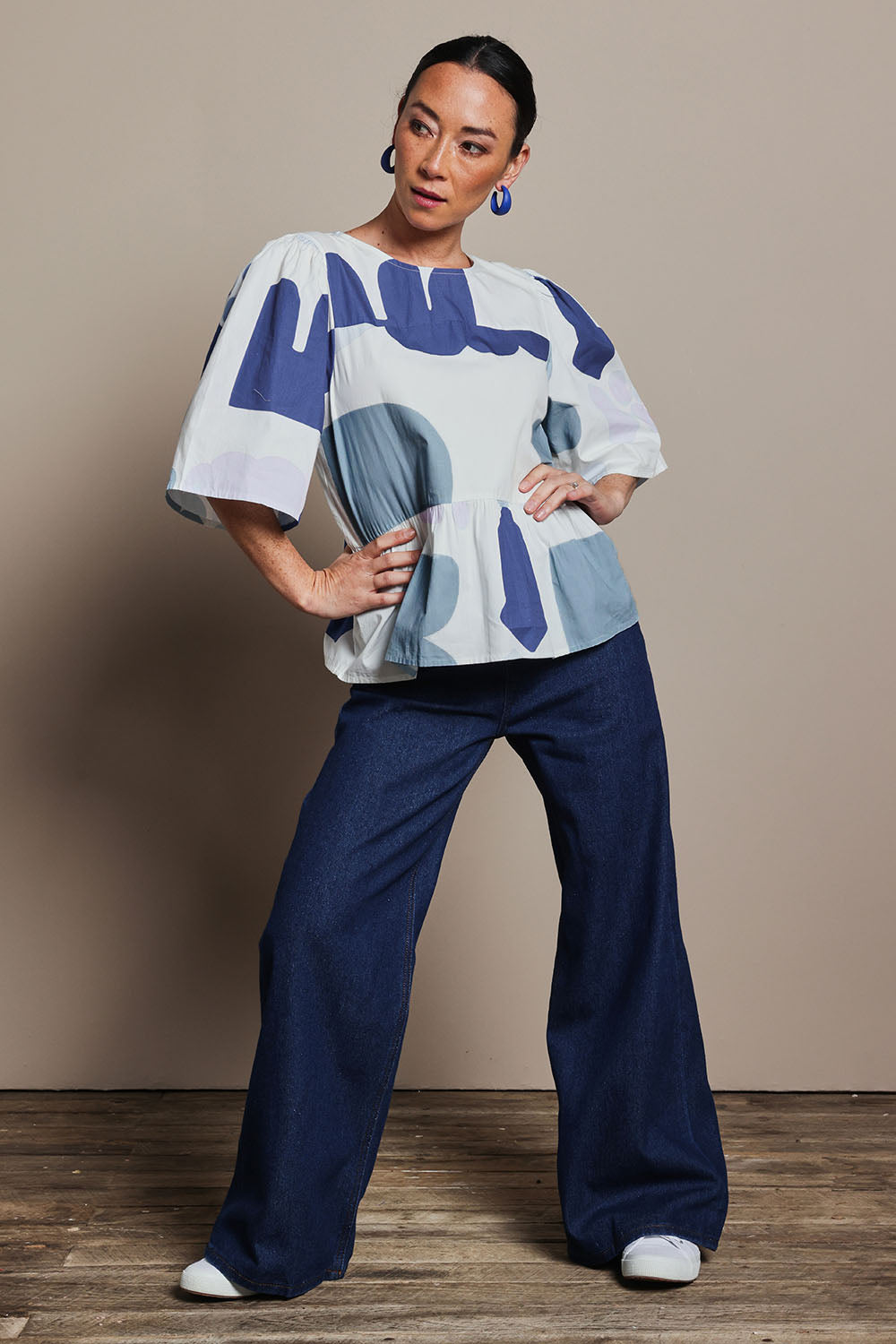 Model Katie wearing size 10 of the Cotton Tiered Blouse in colour Abstract (Blue), from the front, showing the whole outfit