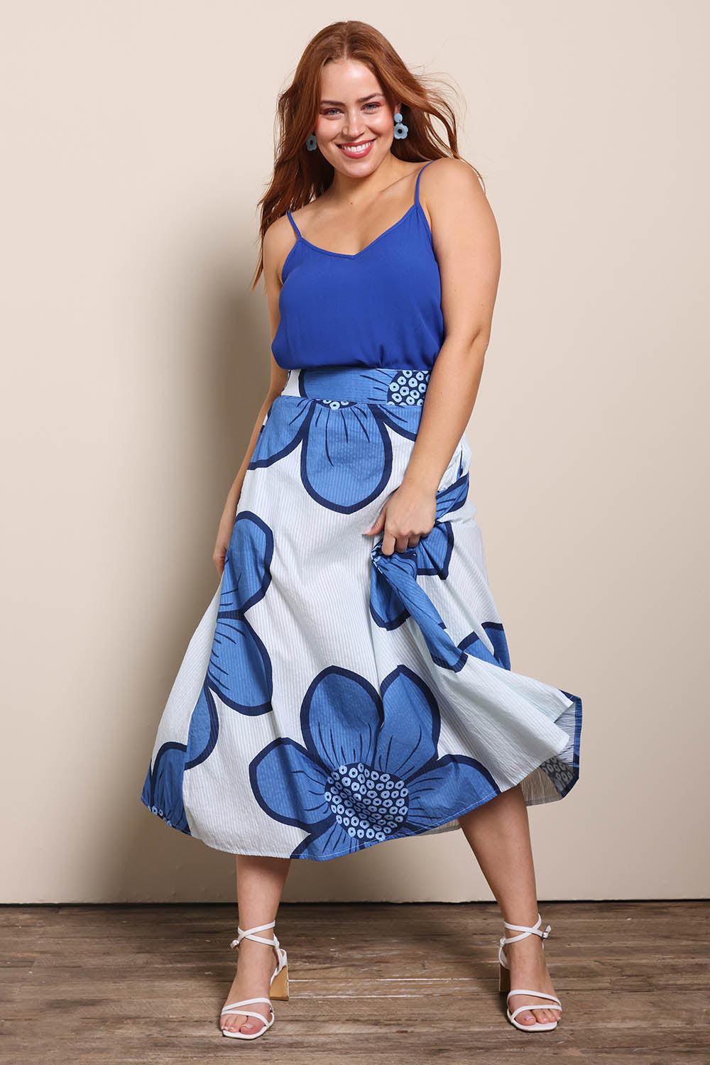 Model Georgiel wearing size 10 of the Cotton Flower Skirt – Blue in colour Blue, from the front