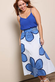 Model Georgiel wearing size 10 of the Cotton Flower Skirt – Blue in colour Blue, from the front