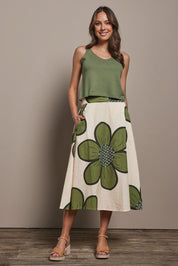 Model Madeline wearing size 10 of the Cotton Flower Skirt in colour Boldflower (Green), from the front, showing the whole outfit