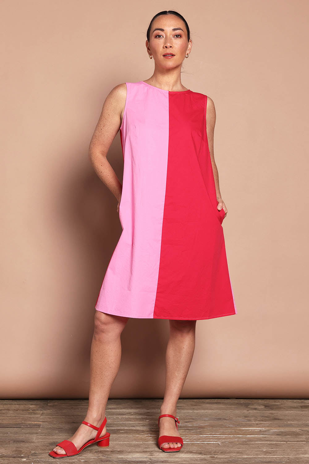 Model Katie wearing size 10 of the Cotton Ain colourLine Split Shift Dress - Redpink (Red), from the front, showing the whole outfit