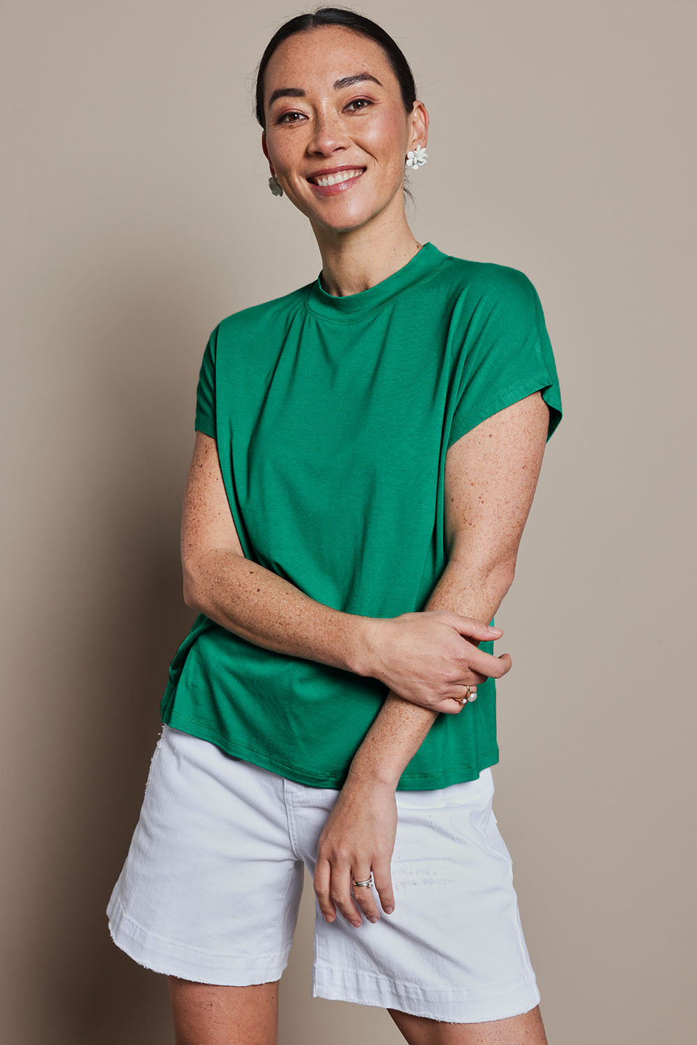 Model Katie wearing size 10 of the Cap Sleeve Tee in colour Green (Green), from the front, cropped image