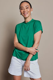 Model Katie wearing size 10 of the Cap Sleeve Tee in colour Green (Green), from the front, cropped image