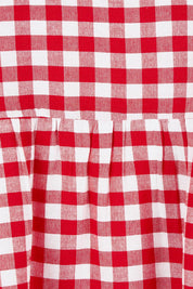 Product shot of the Cotton Empire Waist Dress in colour Ginghamred (Red), detail