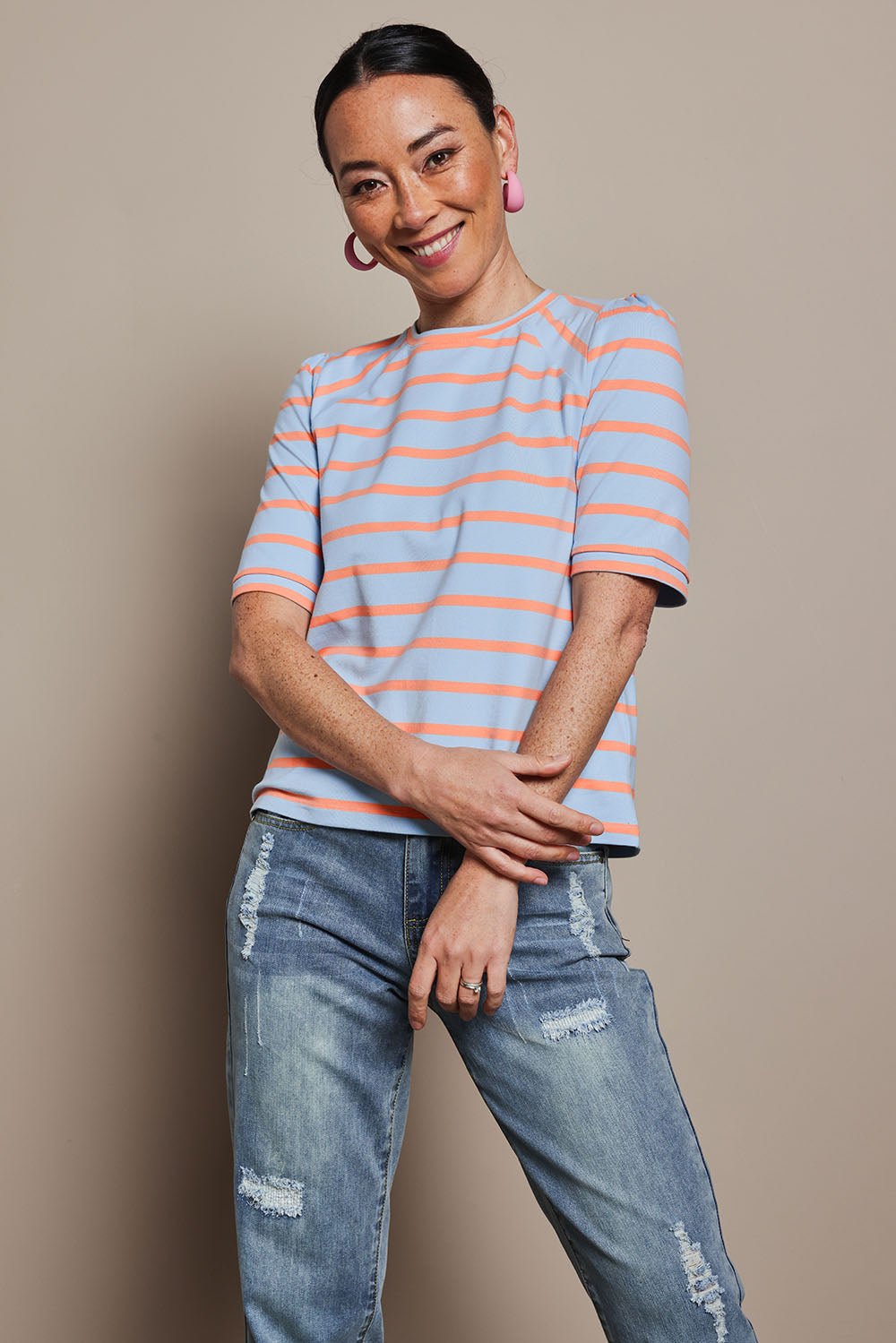 Model Katie wearing size 10 of the Cotton Stripe Puff Sleeve Top in colour Blueorange (Blue), from the front, cropped image