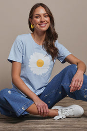 Model Madeline wearing size 10 of the Cotton Daisy Tee in colour Blue (Blue), from the front, showing the whole outfit